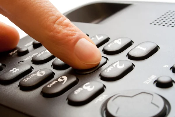 Dialing - telephone keypad with finger