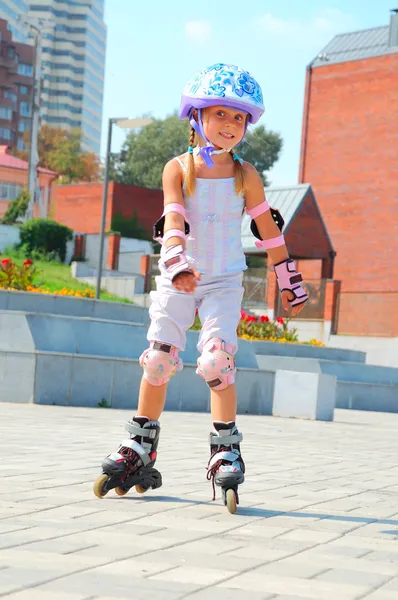 Child on inline rollerblade skates