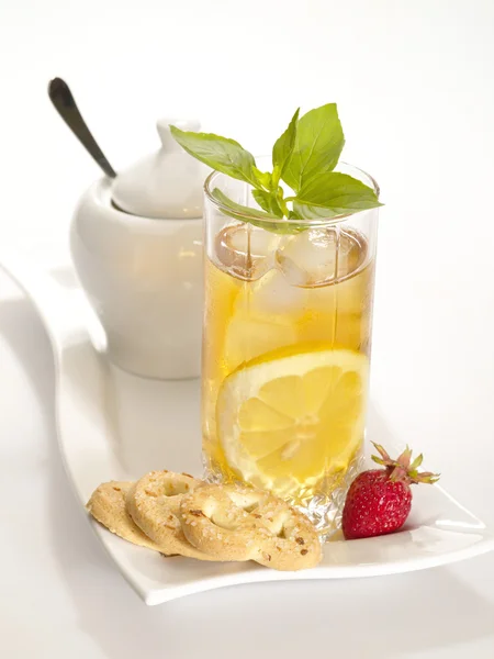 Cold black tea with lemon, ice and wate