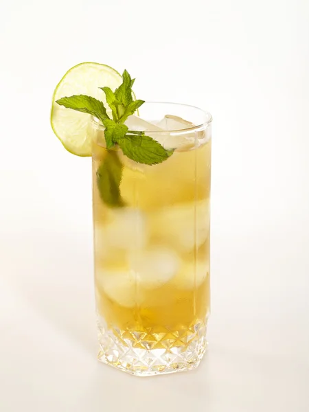 Cold fresh tea glass with lemon and mint