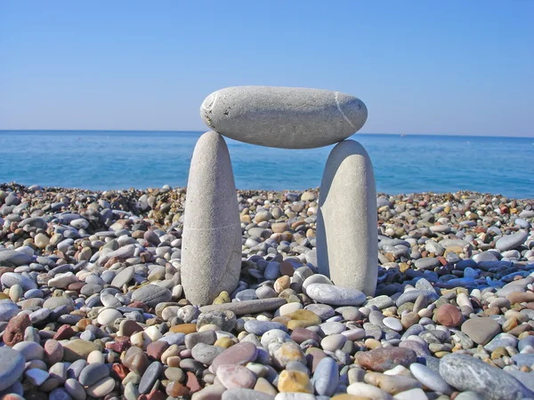 Stone gate on the beach
