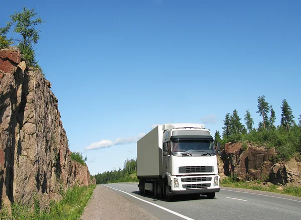 White truck on rocky highway