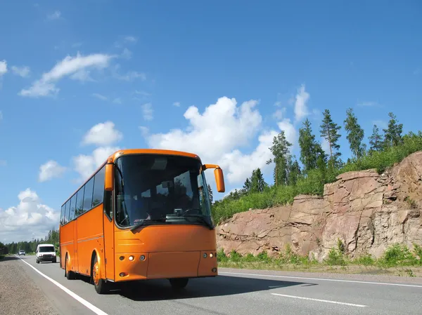 Orange bus on highway