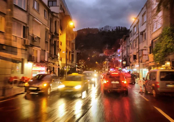 Night traffic in rainy city