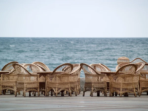 Rattan Chairs Bar Empty on Beach