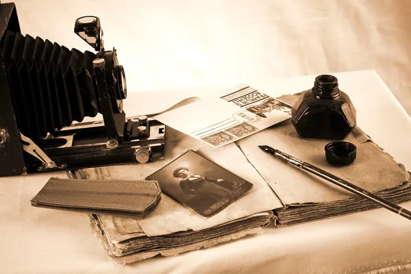 Vintage paper with old books, camera