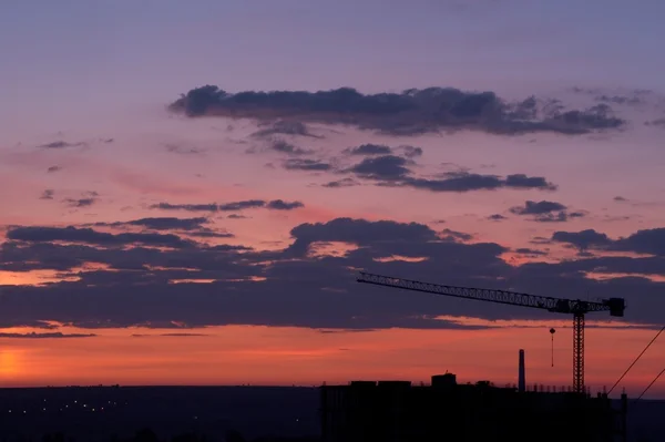 Crane in the sunset sky