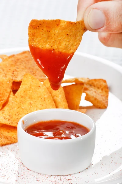 Tortilla chips with hot salsa mexicana