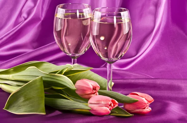 Two glasses and flowers