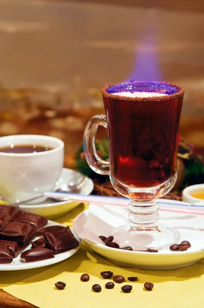 Burning grog decorated with coffee-beans