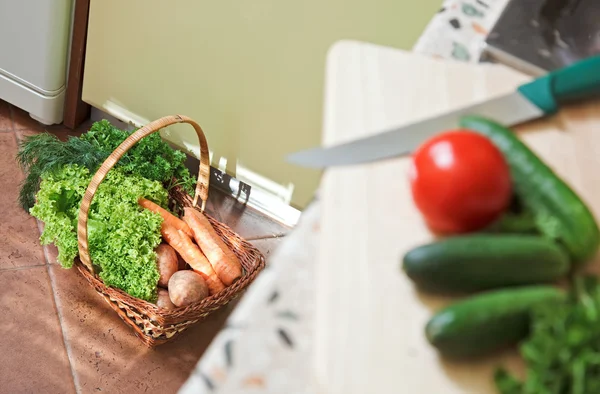 Picnic basket with vegetables on Kitchen
