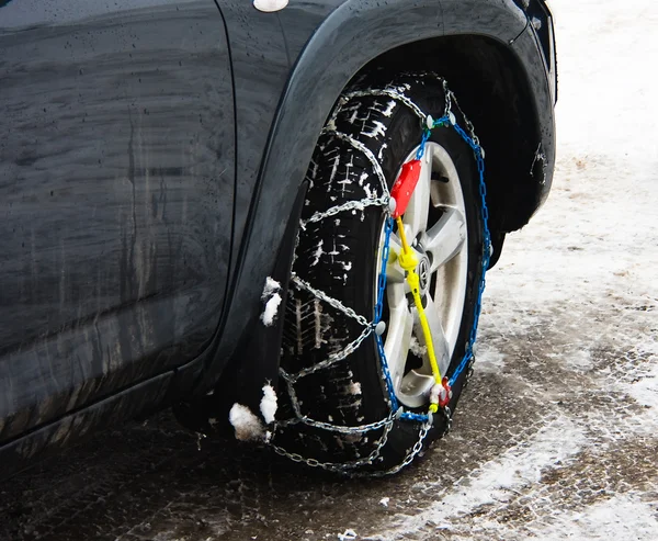 Snow chains on vehicle