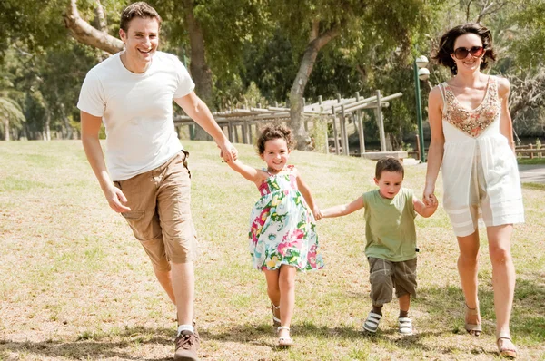 Family running with two children