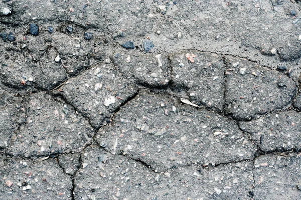 Old asphalt road surface texture