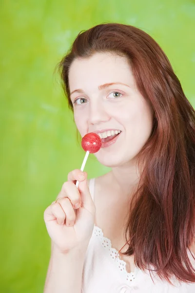 Sexy girl licking lollipop by Iakov Filimonov Stock Photo