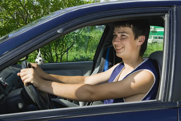 Young men driving a car