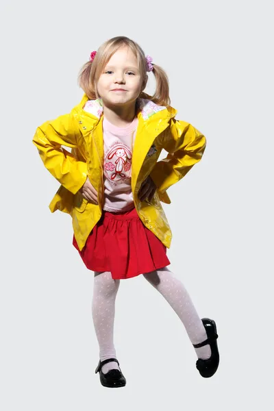 Little girl in a yellow jacket