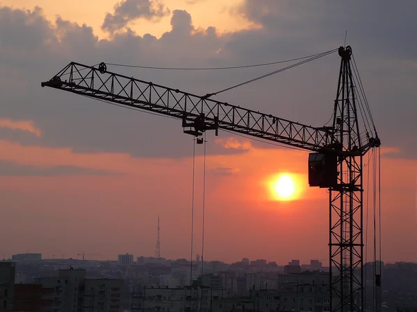 Lifting crane and sunset