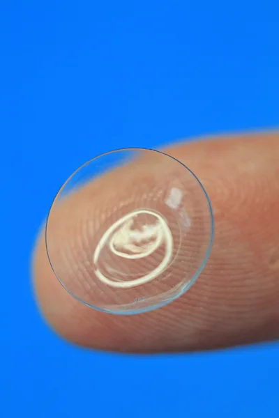 Contact lens on a tip of a finger