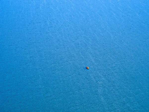 Life raft on sea background.