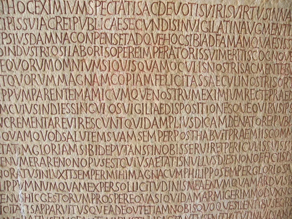 Old text on ancient wall stone