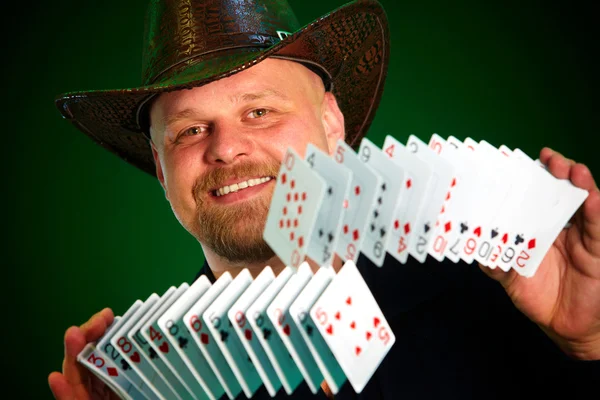 Man skilfully shuffles playing cards