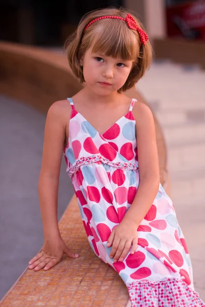 Little girl in a bright dress