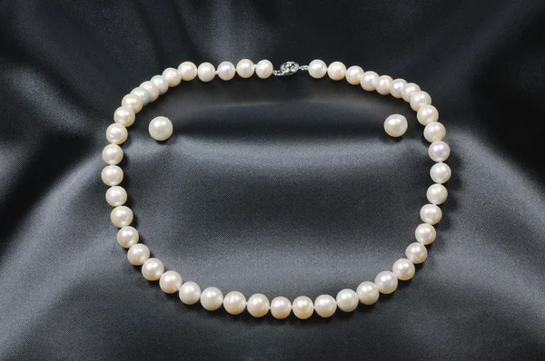 White pearl necklace with pearl earrings