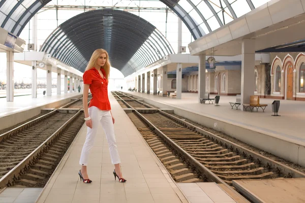 Pin up caucasian woman on railway statio