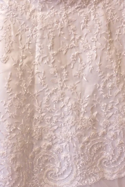 Pattern on a wedding dress close up by Oleksii Tarakhovskyi Stock Photo