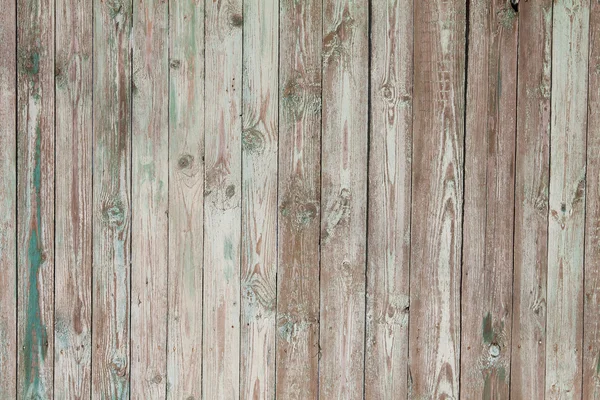 Weathered blue painted wooden fence