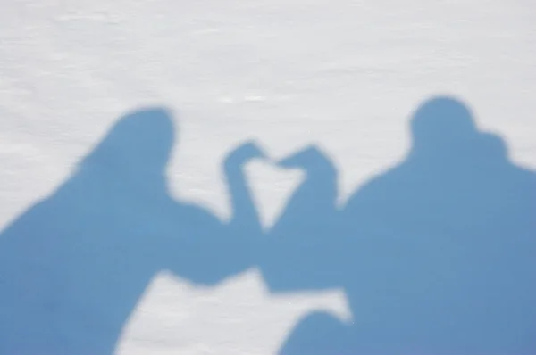 Silhouettes of young in the snow