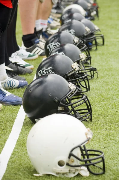 Row of football helmets