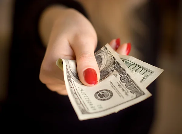 Woman hand giving money