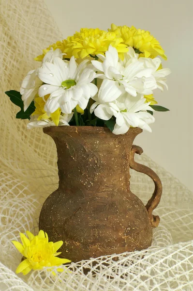 Bouquet of chrysanthemum in old vase