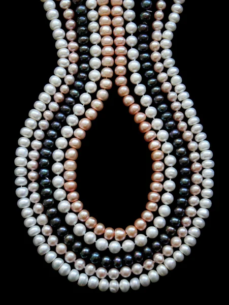 White, black and pink pearls