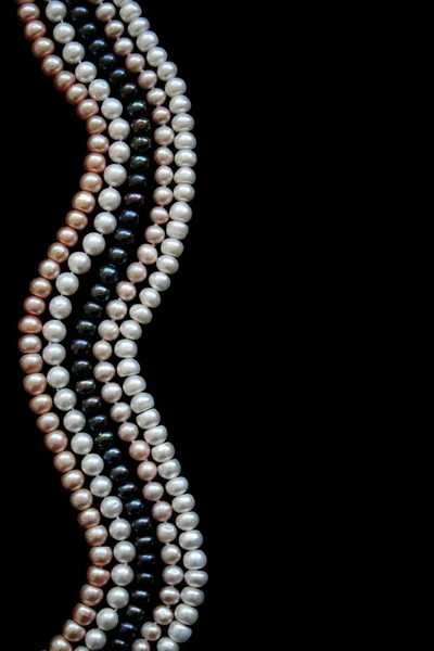 White, black and pink pearls