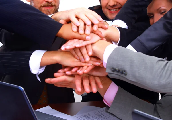 Group of business making a pile