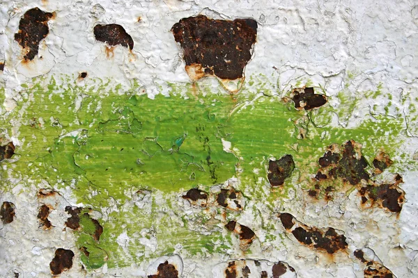 Eroded old paint on metal surface