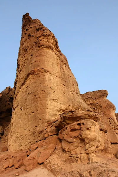 Triangular sandstone rock in the desert