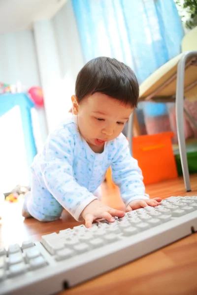 Little boy with keyboard, soft focus