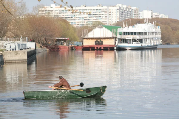 Man in Green Boat