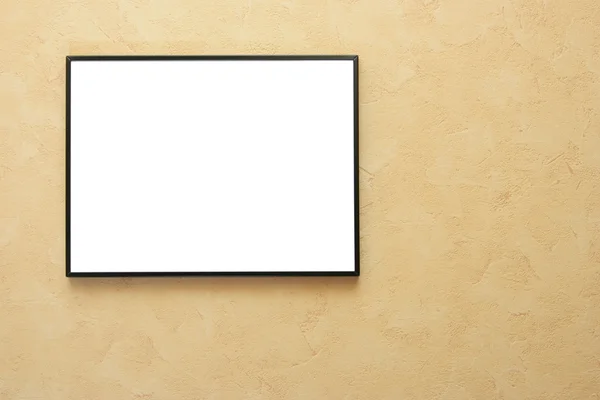 Blank frame over yellow wall