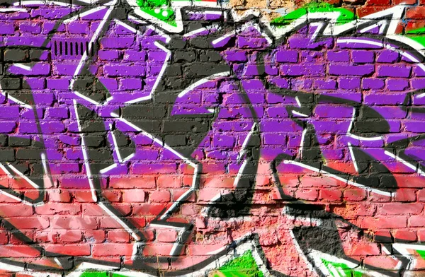 Brick wall with graffiti close-up