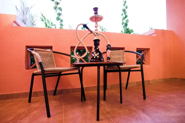 Hookah on table and chairs