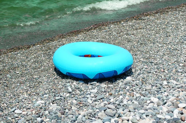 Ring buoy on the beach in summer