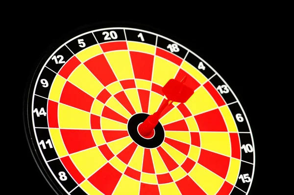 Darts board with one arrow — Stock Photo #2656186