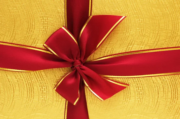 Close up of the gift box with red ribbon