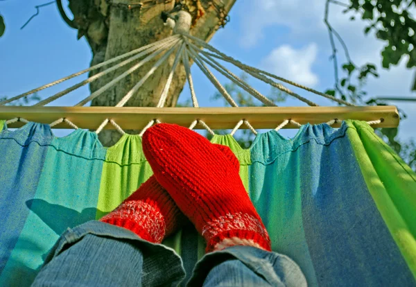Female Feet in Red Woolen Socks