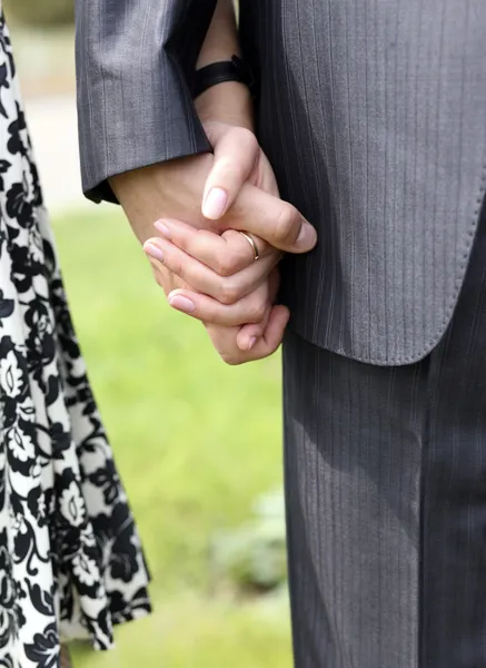 Close-up on young man and woman hands ho
